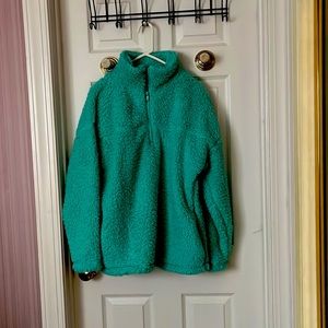 Greenish polar fleece pullover.